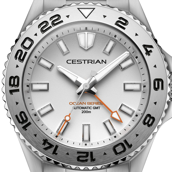 Cestrian Ocean Series CO-SWS001 close-up view of silver white dial face with steel hands and orange GMT hand
