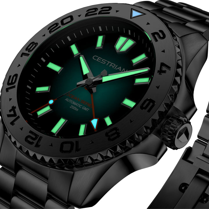 Cestrian Ocean Series CO-BKS001 angled view displaying luminous dial elements and GMT bezel details in the dark