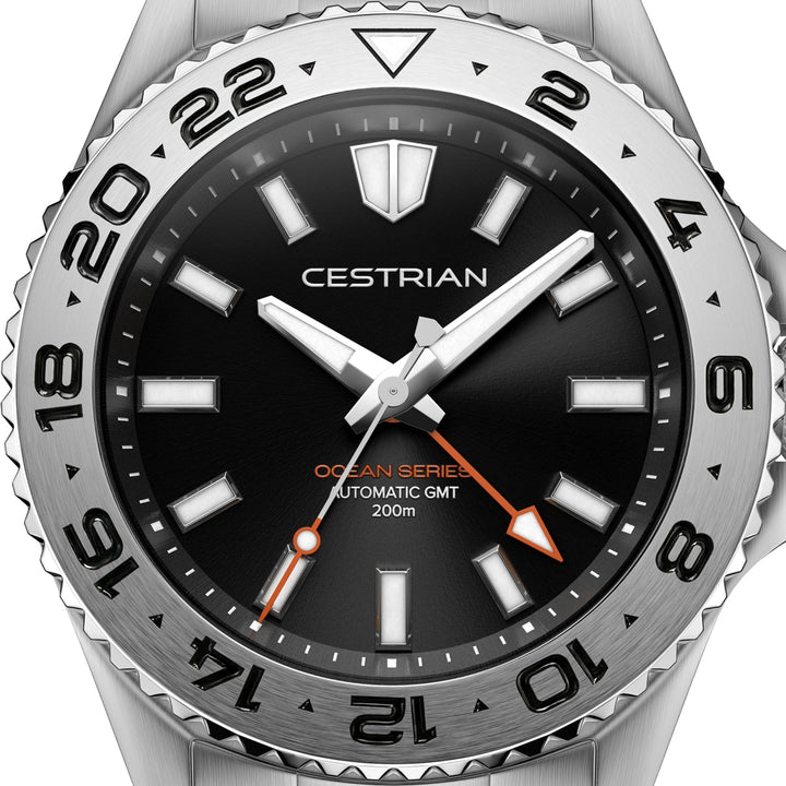Cestrian Ocean Series CO-BKS002 close-up view of black dial face with steel hands and orange GMT hand