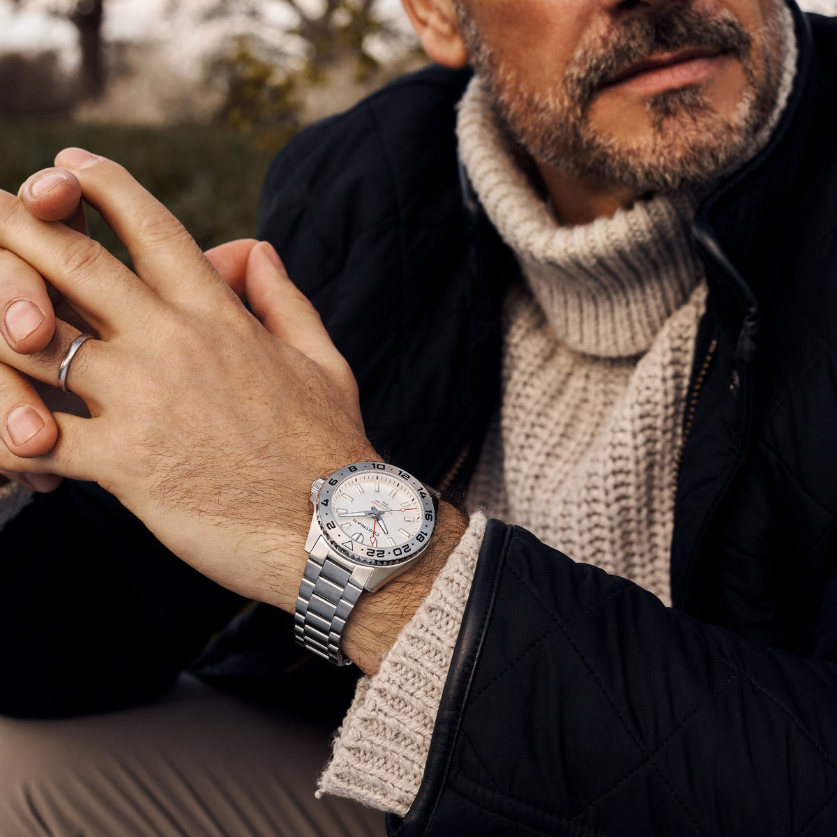 Cestrian Ocean Series CO-SWS001 lifestyle portrait of model wearing silver white dial GMT watch with hands clasped