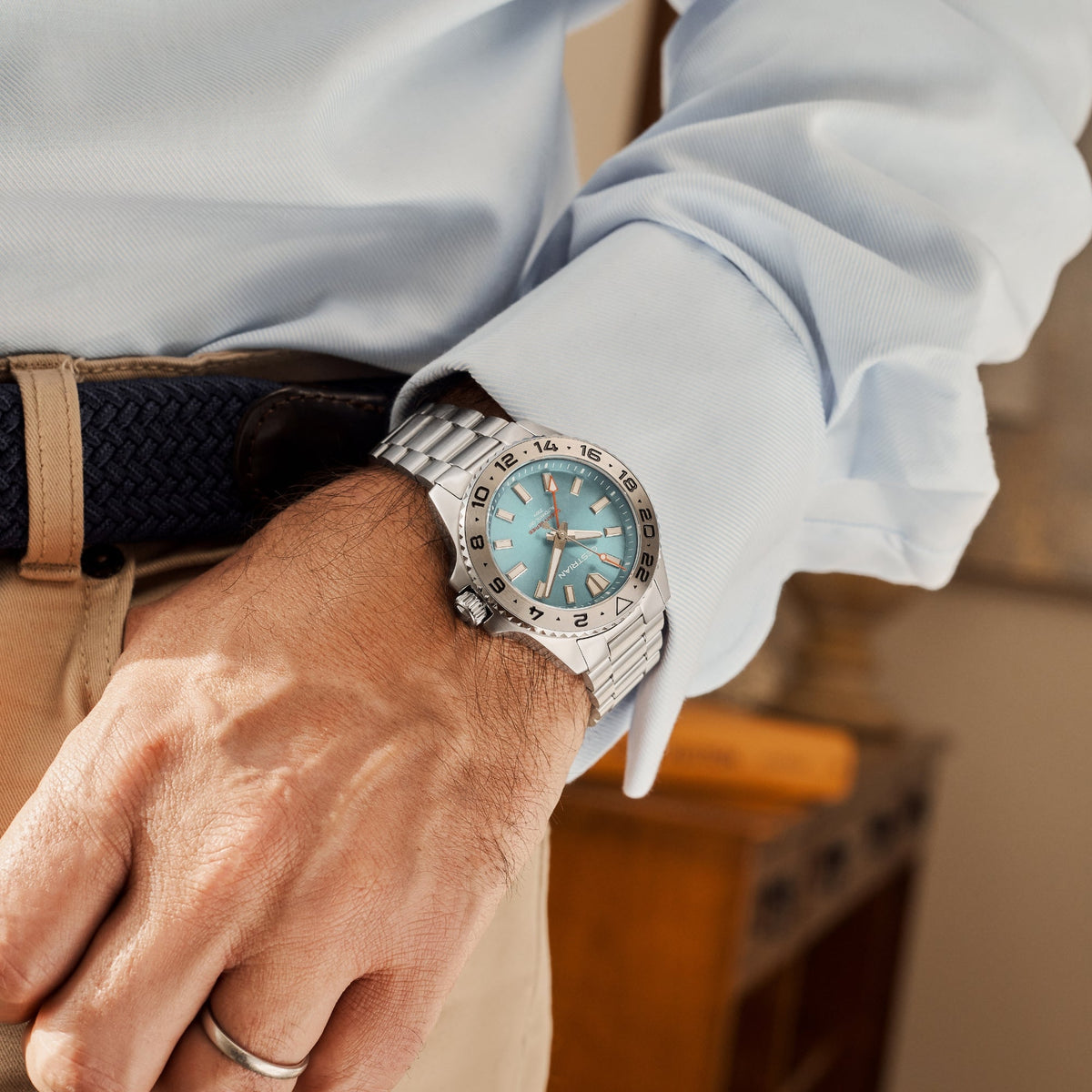 Cestrian Ocean Series CO-TBS001 lifestyle shot of watch with tropical blue dial worn on wrist under shirt cuff