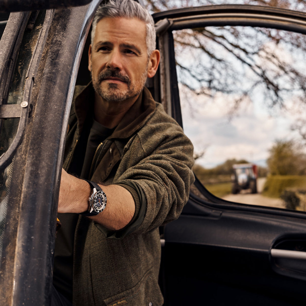 Cestrian Pro Dive Series CP-BLB002 outdoor lifestyle shot featuring watch with blue fumé dial on model by vehicle